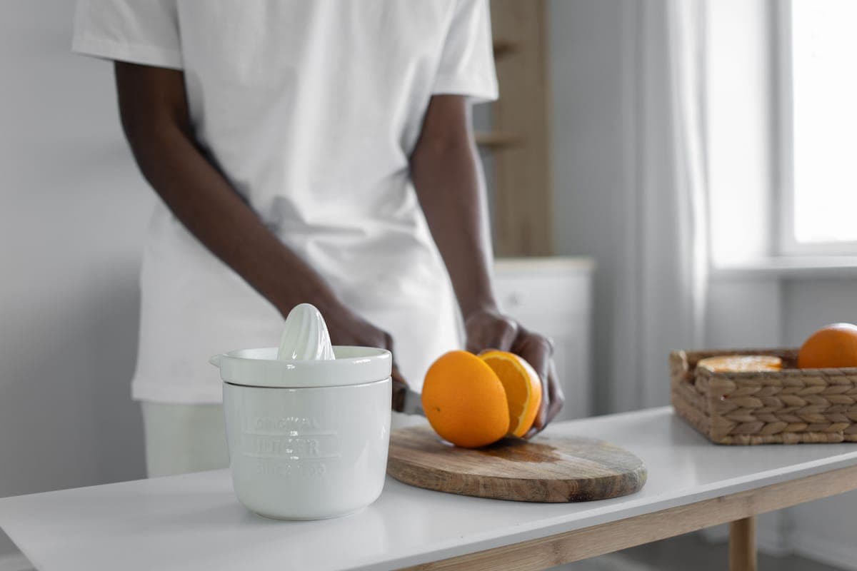 A juicer on a sunlit morning kitchen counter