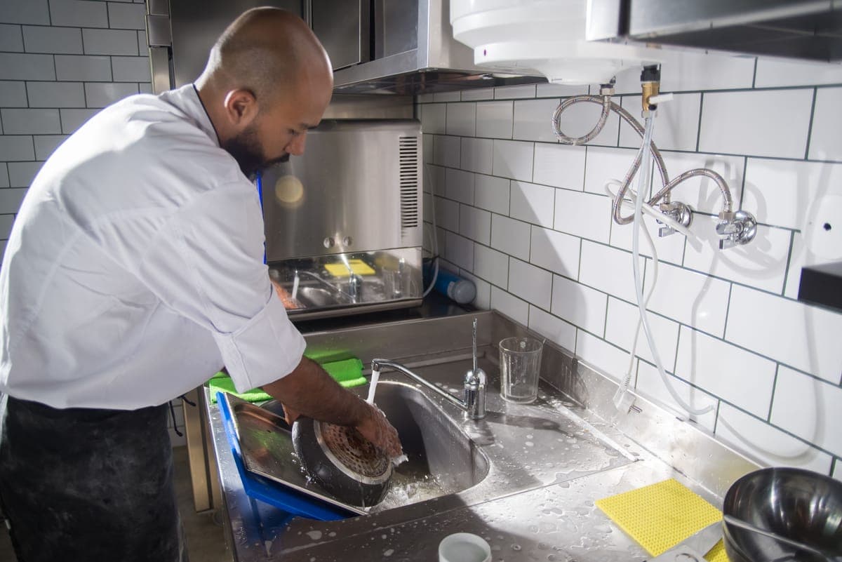 A kitchen sink with rinsed juicer parts